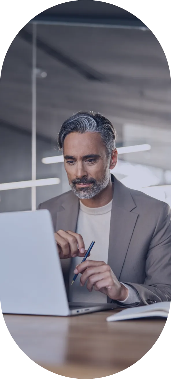 Publisher reviewing performance on a laptop