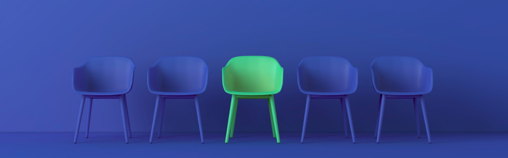A row of empty navy chairs with one bright green chair standing out in the middle.