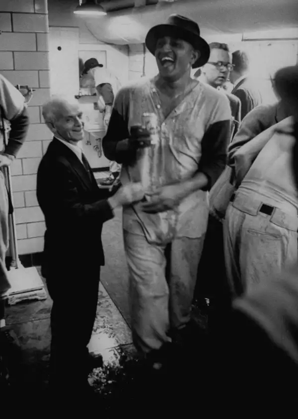 Often overshadowed by Robinson and Campanella, Newcombe won 20 games in 1955 and 27 in 1956, earning both the Cy Young and MVP that year. Above: Newcombe relishes the Bums' first title.