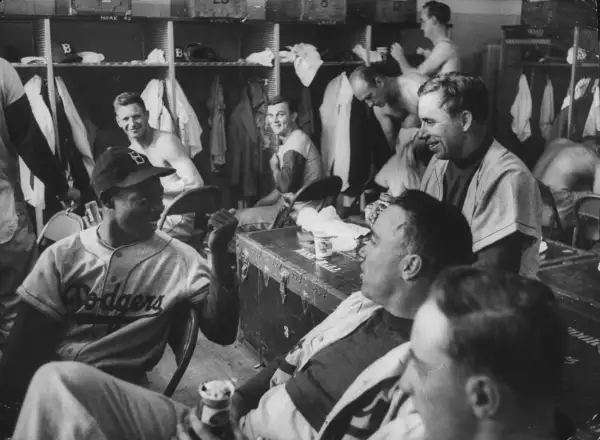By the 1950s, the Dodgers were multicultural enough that Cuban Sandy Amoros (far left) joked easily with Pee Wee Reese (on trunk) and Duke Snider (with beer).