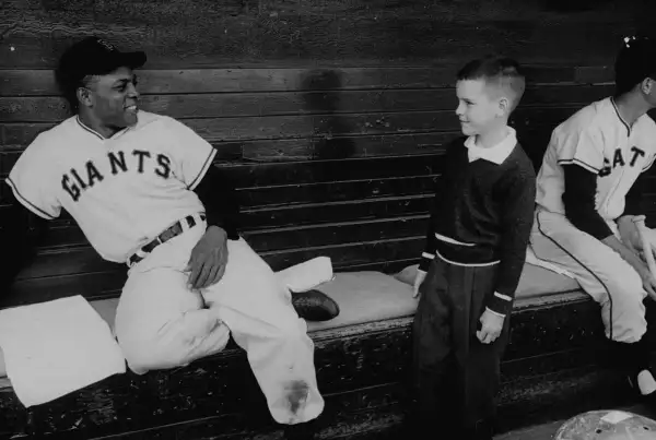 Mays always loved to interact with kids. As a New York Giant he would frequently play stickball with kids in Harlem, and today his foundation benefits underprivileged youth.