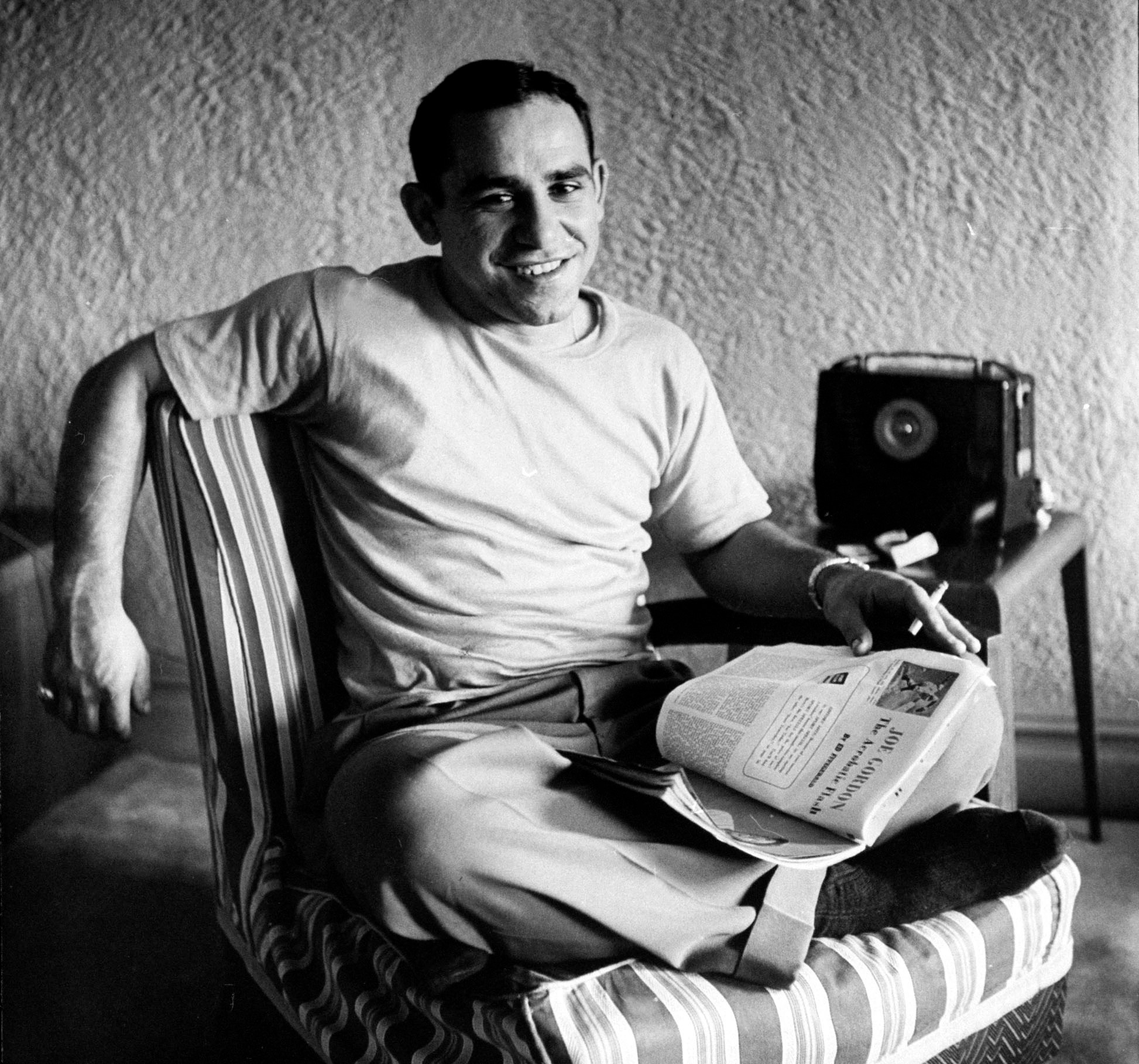 Yogi Berra relaxes at home.