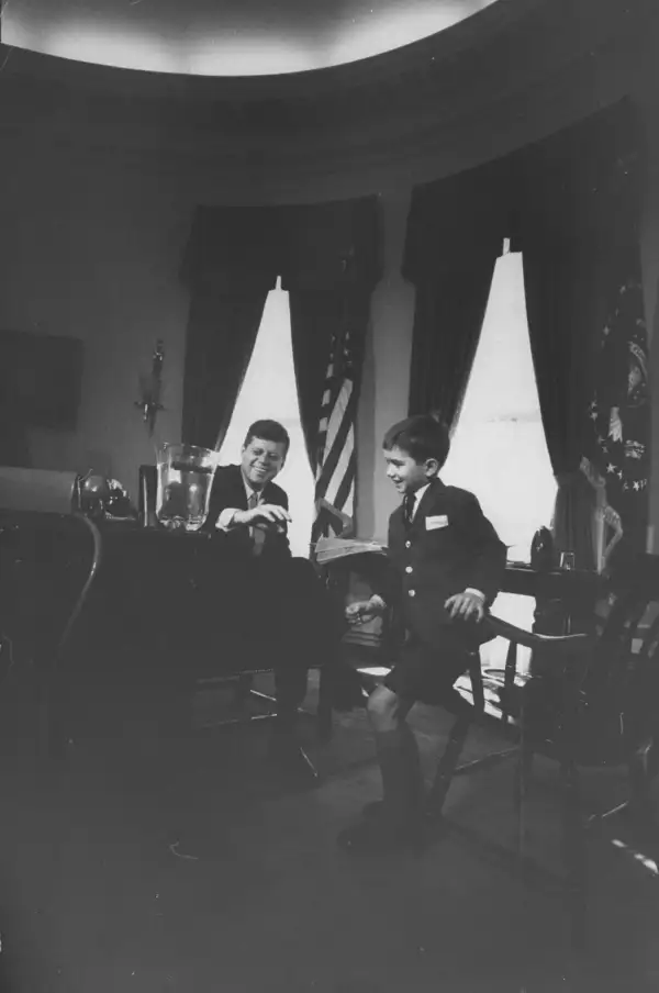 President Kennedy receives a gift salamander from his nephew, Robert F. Kennedy, Jr., in the Oval Office in March 1961.