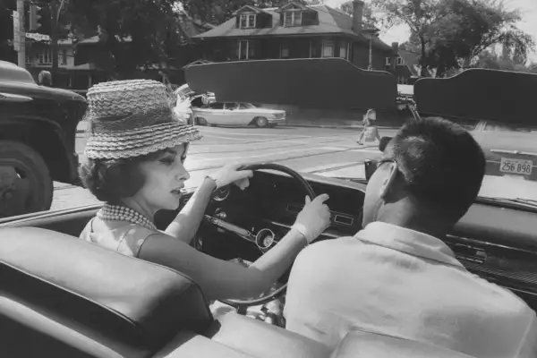 Gina Lollobrigida takes a driving lesson through the streets of Toronto.
