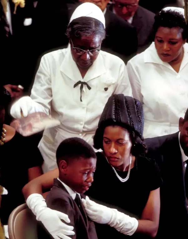 To lose a loved one to bullets that come from hatred, from violence that comes from degrading another human being... To see the women that have gathered around this young man to comfort him, and the mother having to tell her son to be strong when you know she's going through her pain too of losing her husband -- it just made me feel sad.