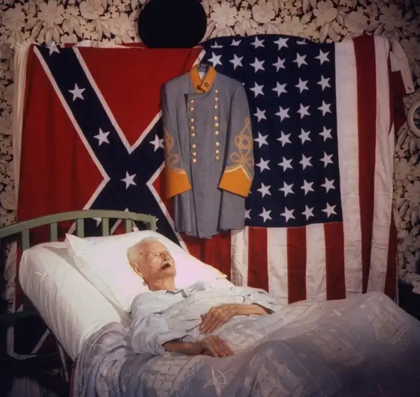 LIFE came to see Williams again in May 1959, seven months before his death, as his fame as the  last living Civil War veteran  grew:  Flanked by the two flags he has loved and a dress version of a Confederate uniform, the last living veteran of the War between the States lies in an uptilted bed, sleeping mostly, waking to eat and puff an occasional cigar.  By this time, Williams was living with a daughter — one of his 19 children — in Houston.