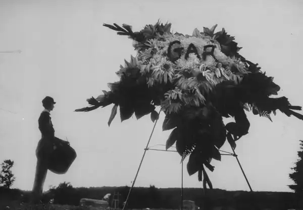 As part of Woolson's funeral, a drummer boy stands guard at his grave, decorated with a wreath in tribute to the Grand Army of the Republic (the fraternal organization, comprising Union veterans, that died along with Woolson).