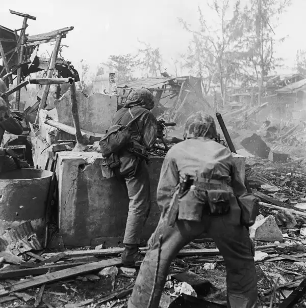 Under Fire
              
              United States Marines advance on positions held by Japanese forces in Tanapag, Saipan, June 1944.