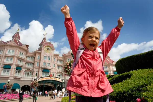A child shows excitement at the entrance to Disneyland Paris, France. Image shot 07/2009. Exact date unknown.