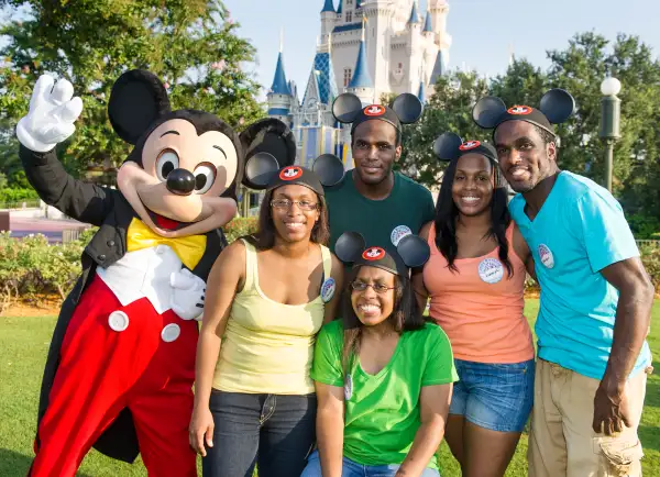 Mickey Mouse posing with the Gaither quintuplets