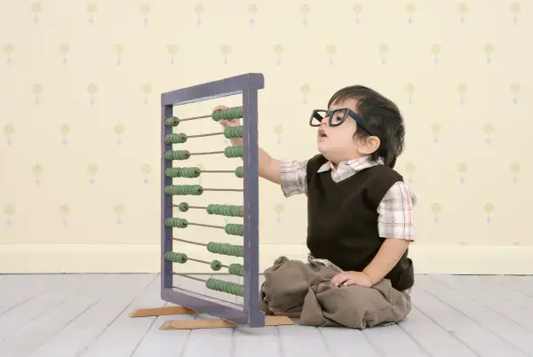Kid learning to use abacus