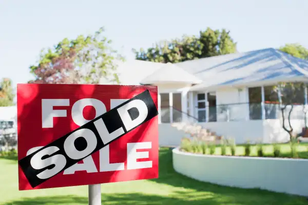 House with SOLD sign