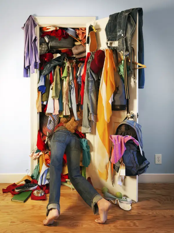 Digging in overflowing closet