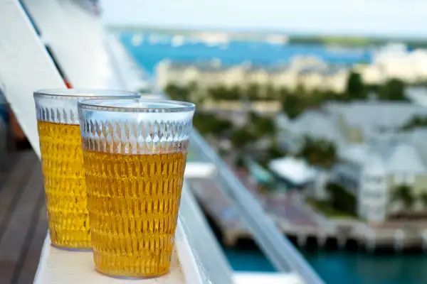 Draft beer glasses on rail of ship
