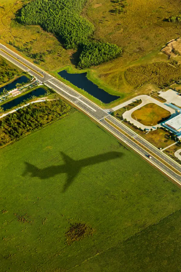 Airplane shadow over farmland