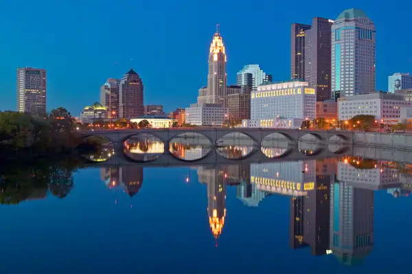 Scioto River and Columbus, Ohio skyline at dusk.