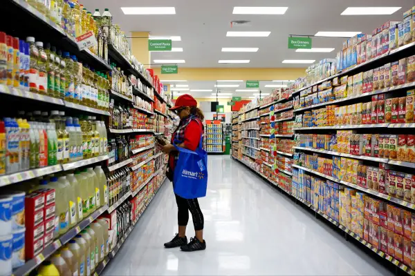 Female shopper in Wal-Mart store aisle