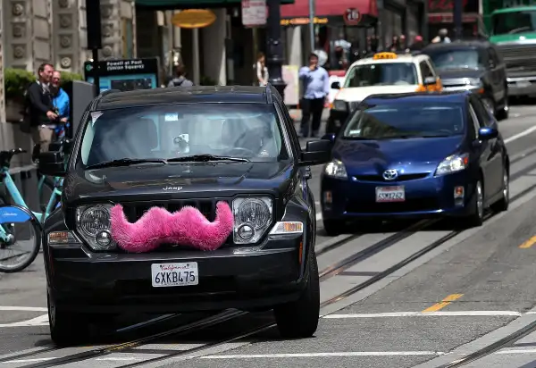 A Lyft car drives along Powell Street on June 12, 2014 in San Francisco, California.