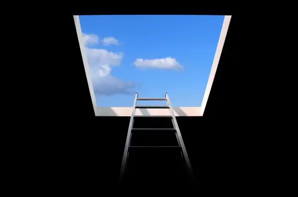 ladder leading to a bright blue sky