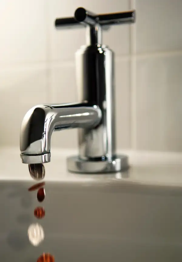 Faucet dripping coins