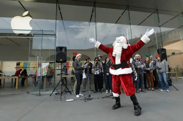Mark Cerqueria, software engineer for the application software company Smule, performs as Santa Claus