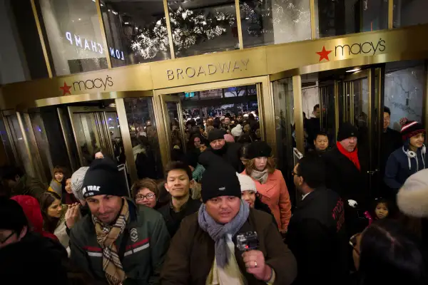 Eager shoppers crowd the entrance as they pour into the Macy's Herald Square flagship store, Thursday, Nov. 28, 2013, in New York