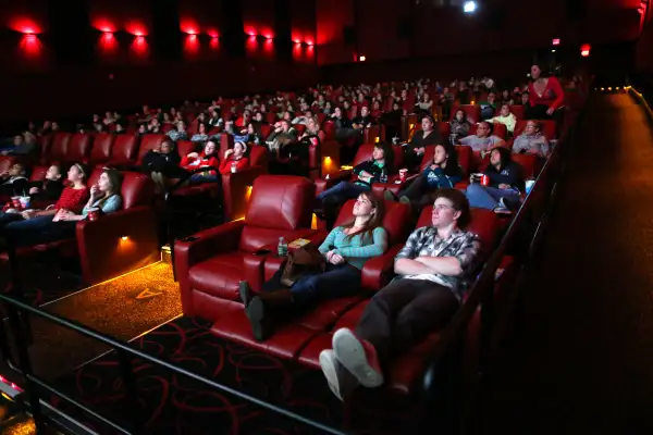 People relax in all powered recliner seats at AMC Movie Theater in Braintree.