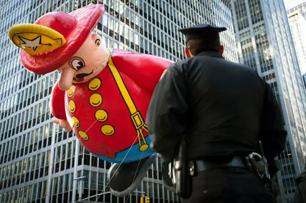 policeman watching the Macy's Thanksgiving day parade