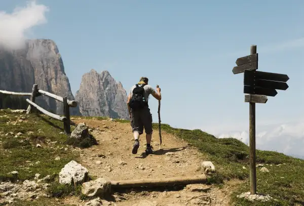 Backpacker on mountain trail