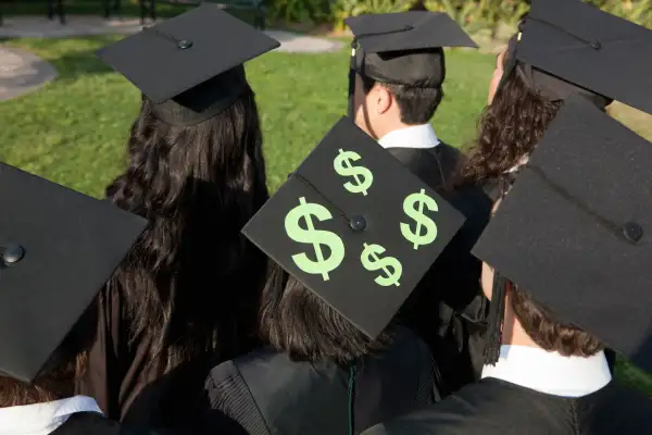 Graduates with $$ on their caps