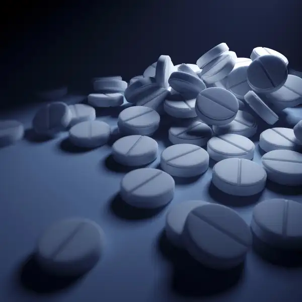 pile of pills in dark lighting