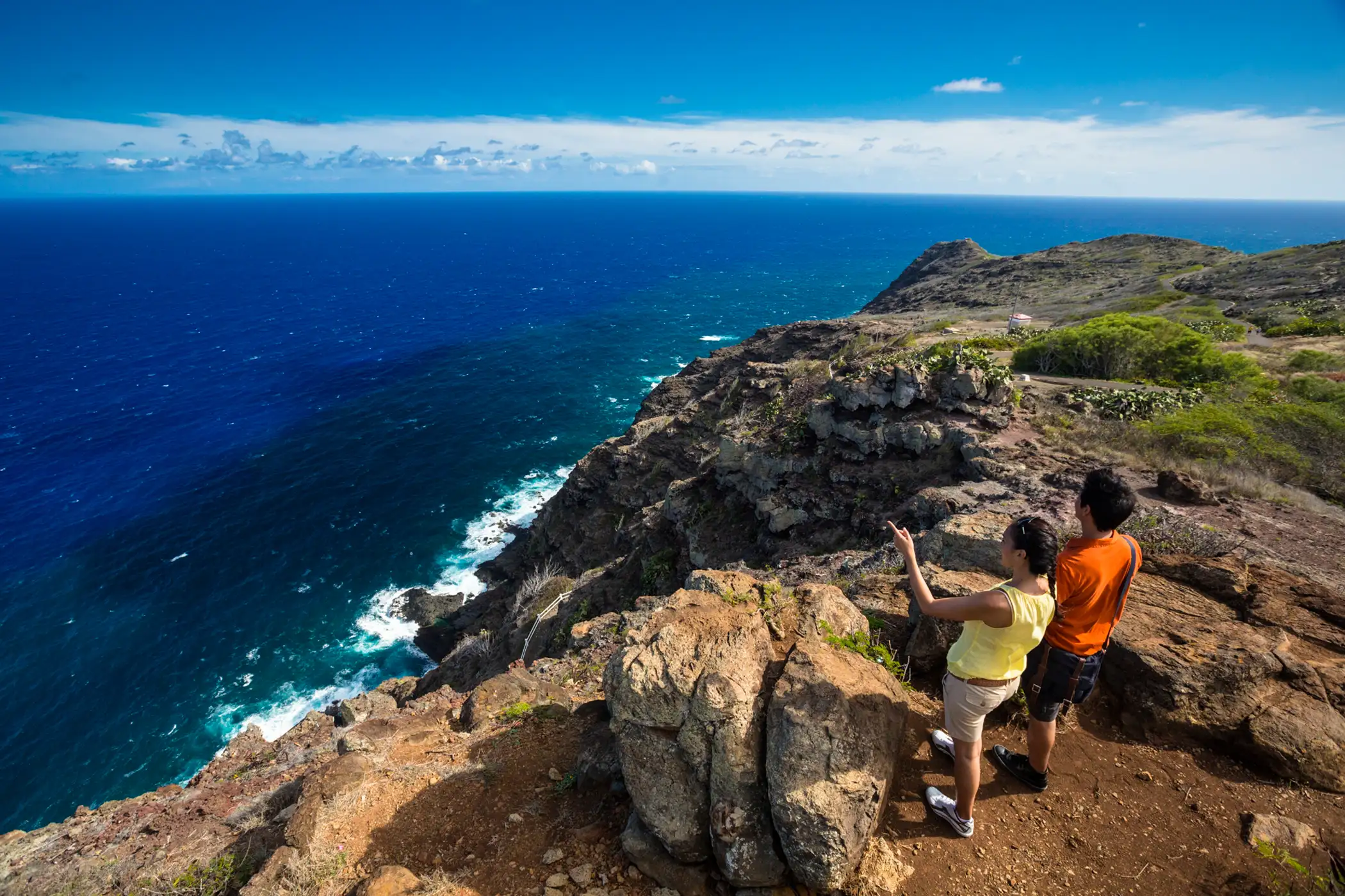 Couple look across the Pacific from Makapuu Trail