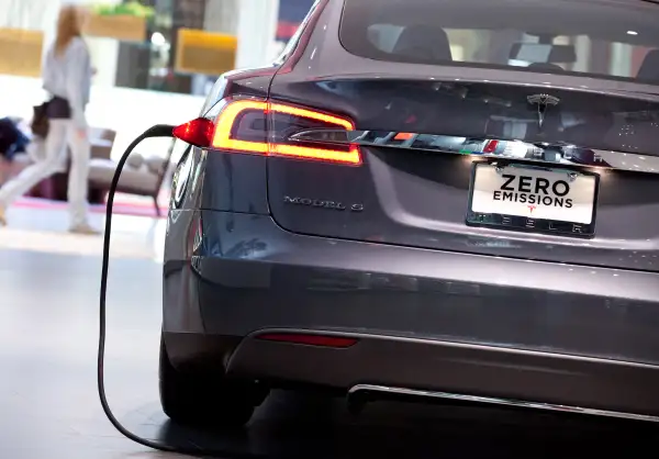 A Tesla Motors Inc. Model S connected to a charger at the Short Hills Mall in Short Hills, New Jersey