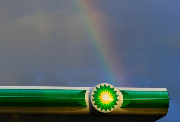 BP gas station with rainbow in the background