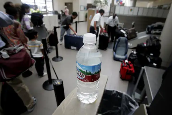 Water near a checked-baggage inspection station at Terminal One at Los Angeles International Airport.