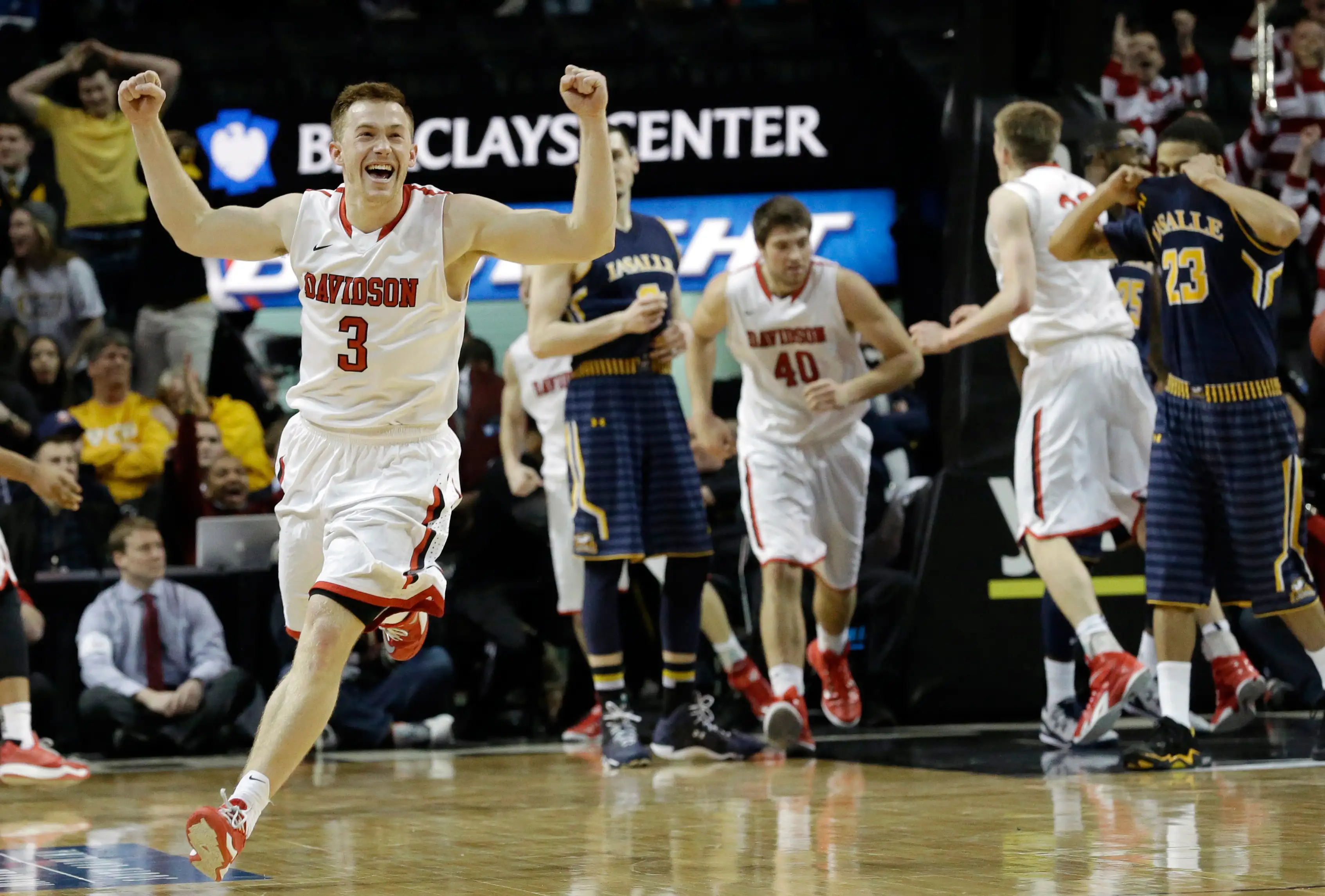 Davidson guard Brian Sullivan (3) celebrates after their 67-66 win over La Salle in an NCAA college basketball game in the quarterfinals of the Atlantic 10 Conference tournament in New York, Friday, March 13, 2015.