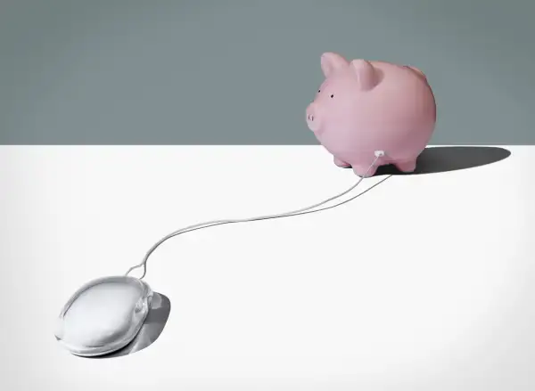 piggy bank connected to computer mouse
