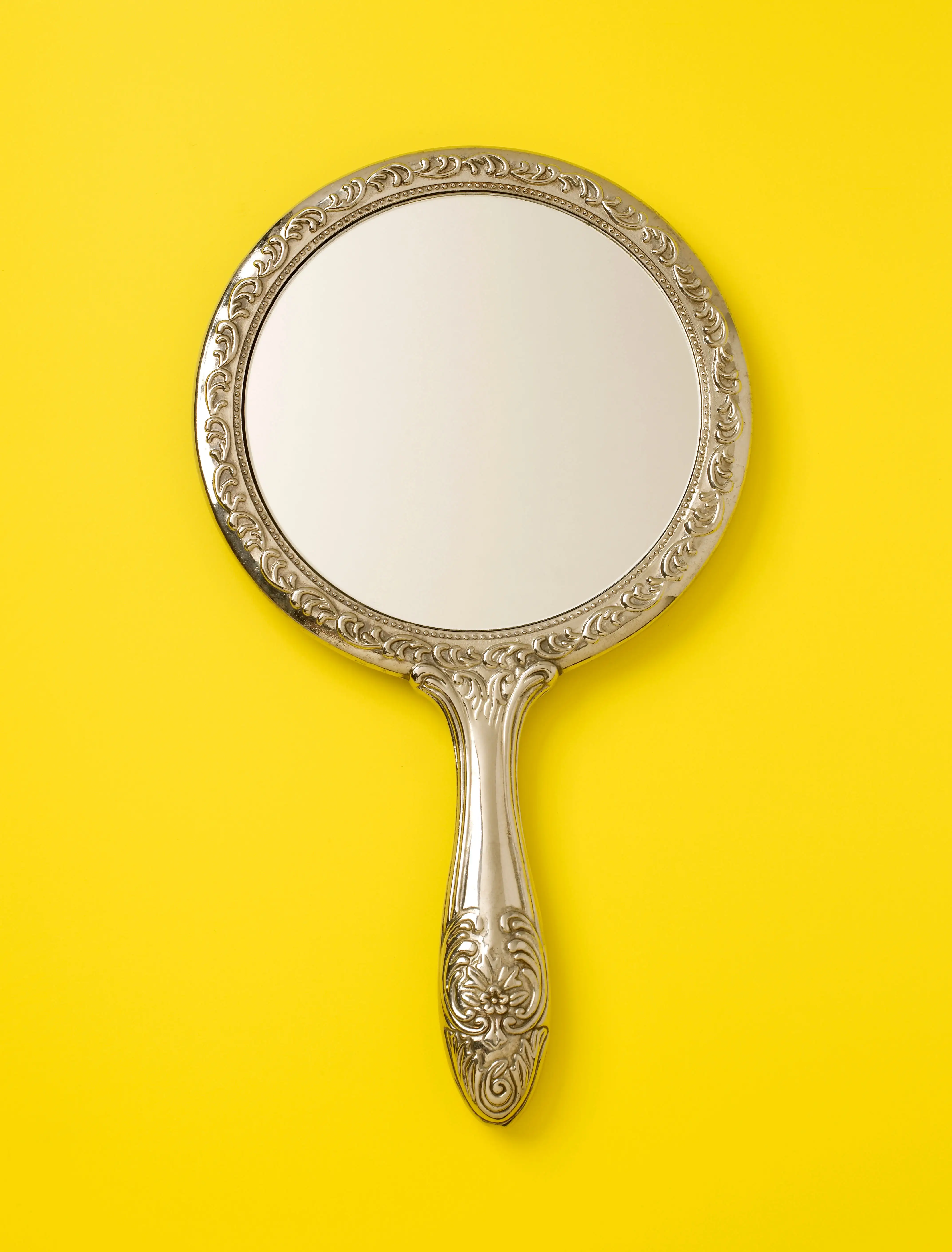 hand mirror on yellow