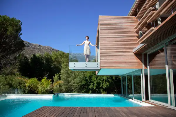 woman on balcony of modern house