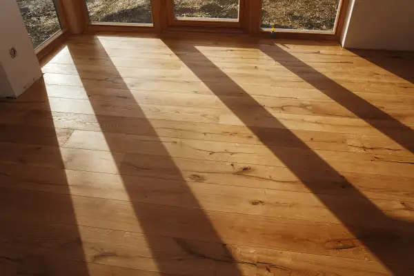 Empty room with finished parquet flooring