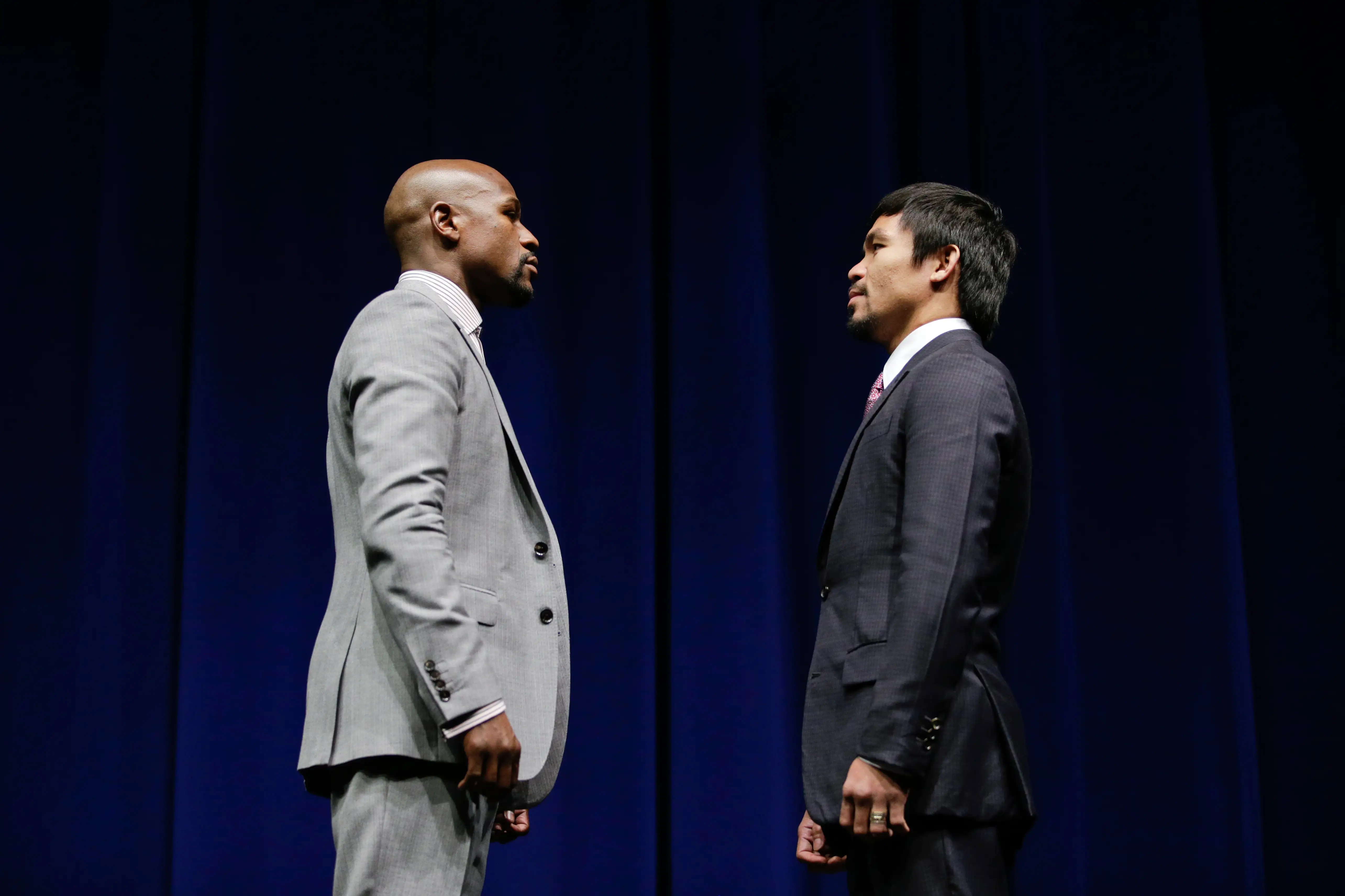 Boxers Floyd Mayweather Jr., left, and Manny Pacquiao, of the Philippines, pose for photos during a news conference, Wednesday, March 11, 2015, in Los Angeles. The two are scheduled to fight in Las Vegas on May 2.