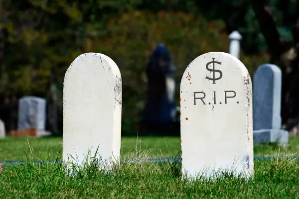 two tombstones, one saying $-RIP