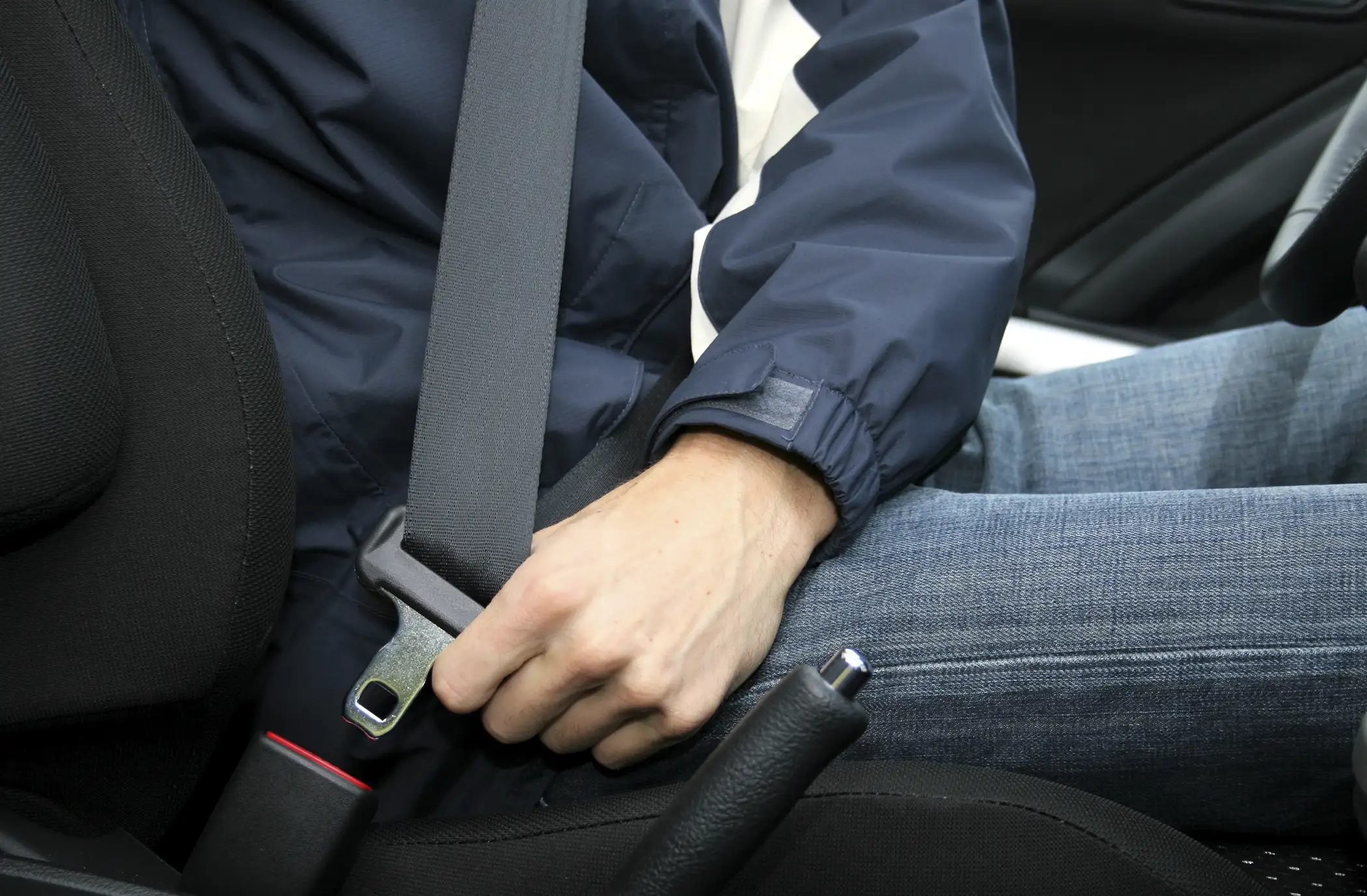 person clicking seatbelt