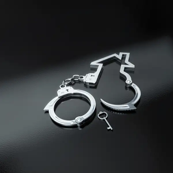house handcuffs laying open with key