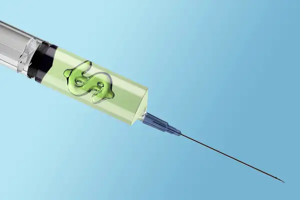 immunization shot with dollar sign bubble in liquid
