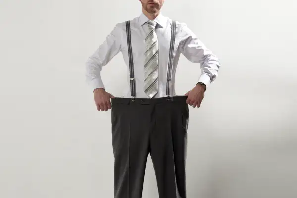 man with too large pants