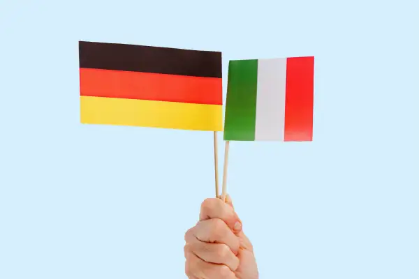 woman holding Italian and German flags