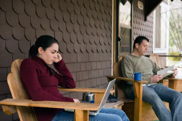 couple sitting in separate chairs