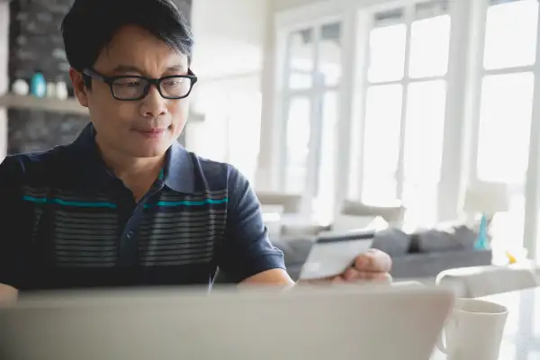 Man checking out his credit card