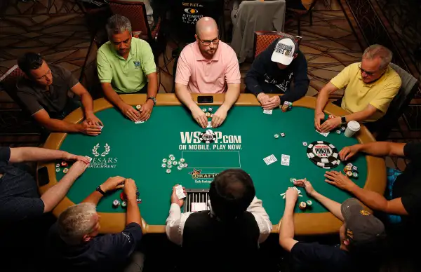 Players compete during the main event at the World Series of Poker Wednesday, July 8, 2015, in Las Vegas.